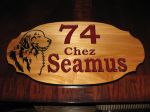 Dog and house address engraved in wood
